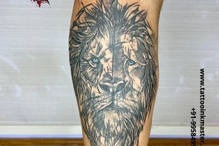 Bold Blue Eyes Lion Tattoo from Tattooinkmaster