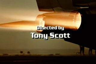 Screen shot off of opening titles for Top Gun, jet engines ablaze under director’s credit.