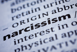 image of the word “narcissism” in a dictionary