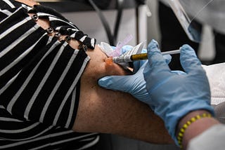 A participant in a Covid-19 vaccine trial receives a dose of the vaccination in Hollywood, Florida…