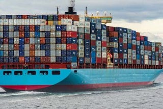 Many containers packed together on a ship