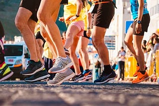 Group of runners warming up at the start of a race