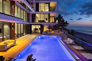 A modern glass house on the beach