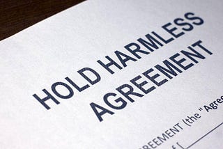 How does a hold harmless agreement work in business