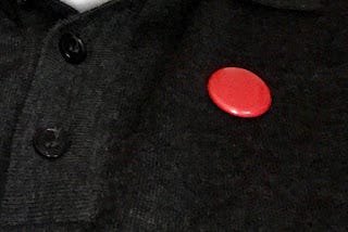 Picture of a red button badge