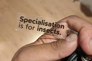 A keyring saying ‘Specialisation is for insects’