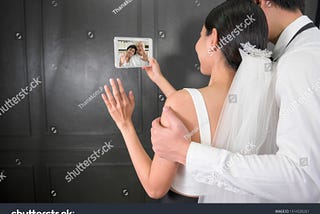 A newly weds couple on a video call with their dear one post wedding