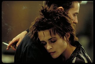 Edward Norton and Helena Bonham-Carter hugging it out in the moment that really begins the story