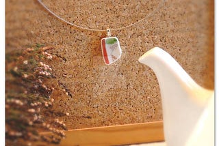 Red, white and green unique sleek ceramic / broken china pendant.