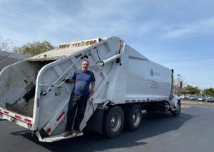 Nick Stroboulis on a garbage truck