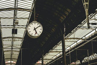 Station clock showing ten past five.