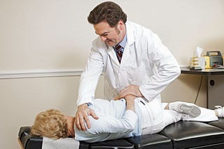 Chiropractor making adjustments