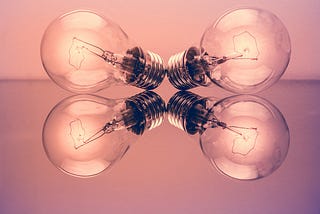 Lightbulbs on pink backdrop