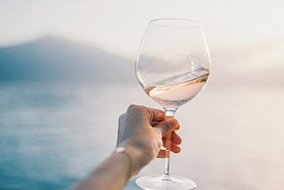 woman hand holding a wine glass