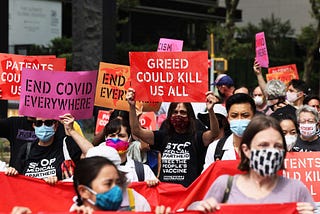 People gather for a protest demanding Pfizer and wealthy nations make the COVID-19 vaccine and treatments more accessible at One Dag Hammarskjöld Plaza on July 14, 2021, in New York City. MICHAEL M. SANTIAGO / GETTY IMAGES