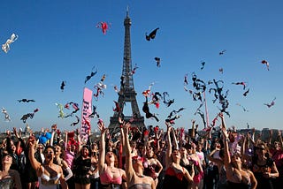 Women throwing their bras in the sky near the Eiffel tower.