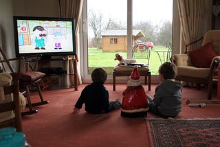 Kids watching TV in the sitting room