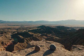 Evelyn and Joy as rocks above the canyon — Everything Everywhere All At Once (2022)