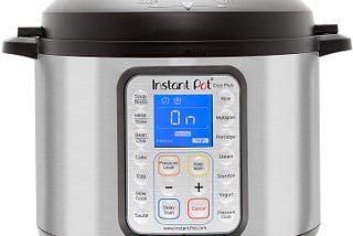 A picture of an Instant Pot. It is silver gray with a black cap and a blue screen inthe middle.