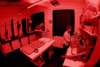 In the red: safe light conditions in the darkroom.