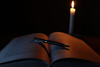 candle and book of spells