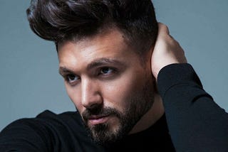 Gay singer Alfie Arcuri on coming out by getting caught in bed with a gay couple