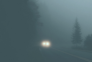 car headlights in fog