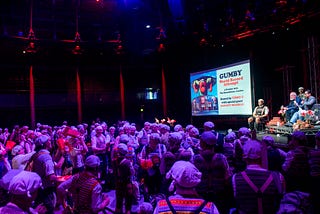 a gaggle of Gumbies attend a Monty Python show, attired like the popular clownish characters in sketches from the UK TV series Monty Python’s Flying Circus