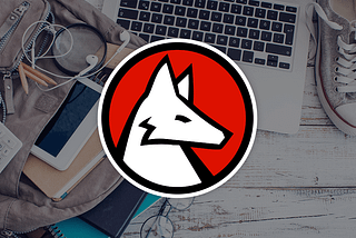 Wolfram logo on a laptop and other school supplies