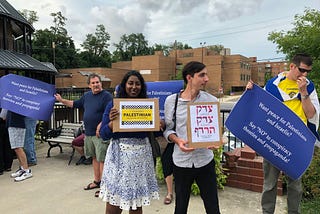 above: Chase Carter from Jews United For Justice (JUFJ) and Jewish Voice for Peace (JVP) standing for the Anti Israel film