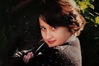 The author as a young girl, looking confidently at the camera.