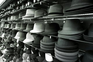 Hats on shelf in store.