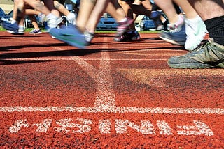 Runners at finish line of track