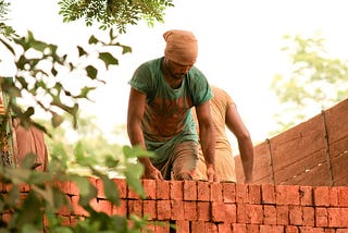 Bricklayer in India. Source: https://www.maxpixel.net/Loading-Bricks-Indian-Labour-Truck-Labourer-166919