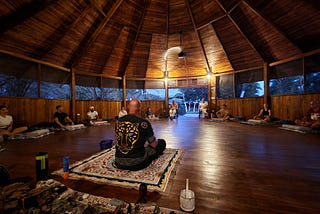 New Life Ayahuasca Costa Rica shaman Matthew sits in the maloca before the ayahuasca ceremony.