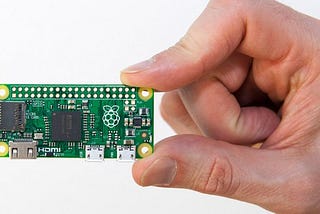 An image of a hand holding a Raspberry Pi Zero