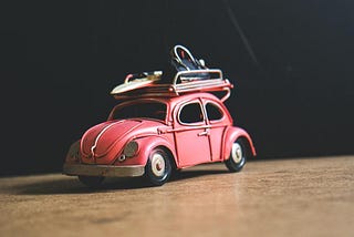 A red classic Volkswagen Beetle.