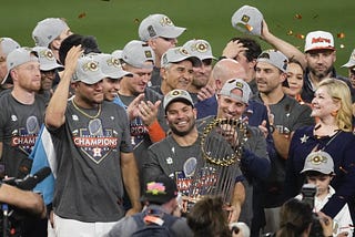 Jose Altuve of the Houston Astros holds the Commisioner’s Trophy following the Astros’ 2022 World Series win.