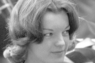 A black and white picture of Romy Schneider’s face in 1959 in Italy, on a movie set