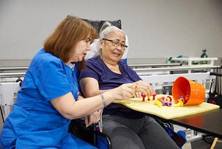 Occupational Therapist helping a senior woman