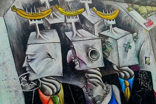 colorful street art of block heads with forks skewering bananas
