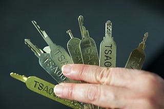 TSA Master Keys, Threat Models, and Encryption