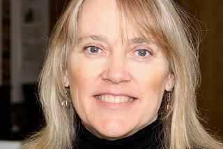 Headshot of Vicki, smiling at the camera