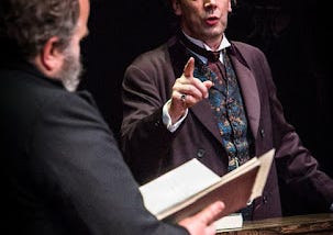 Actor Steven Elliot as Oscar Wilde points a finger at the prosecution barrister