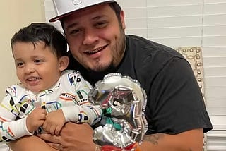 Image of Garcia holding one of his little ones