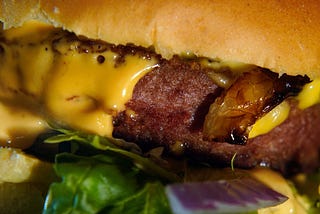 Closeup of a vegan cheeseburger