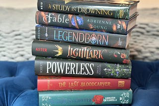 a stack of YA fantasy books