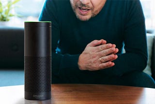 A man talks to an Amazon Alexa device