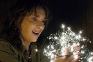 winona ryder holding fairy lights on stranger things netflix show