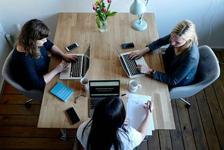 Colleagues working together at a table